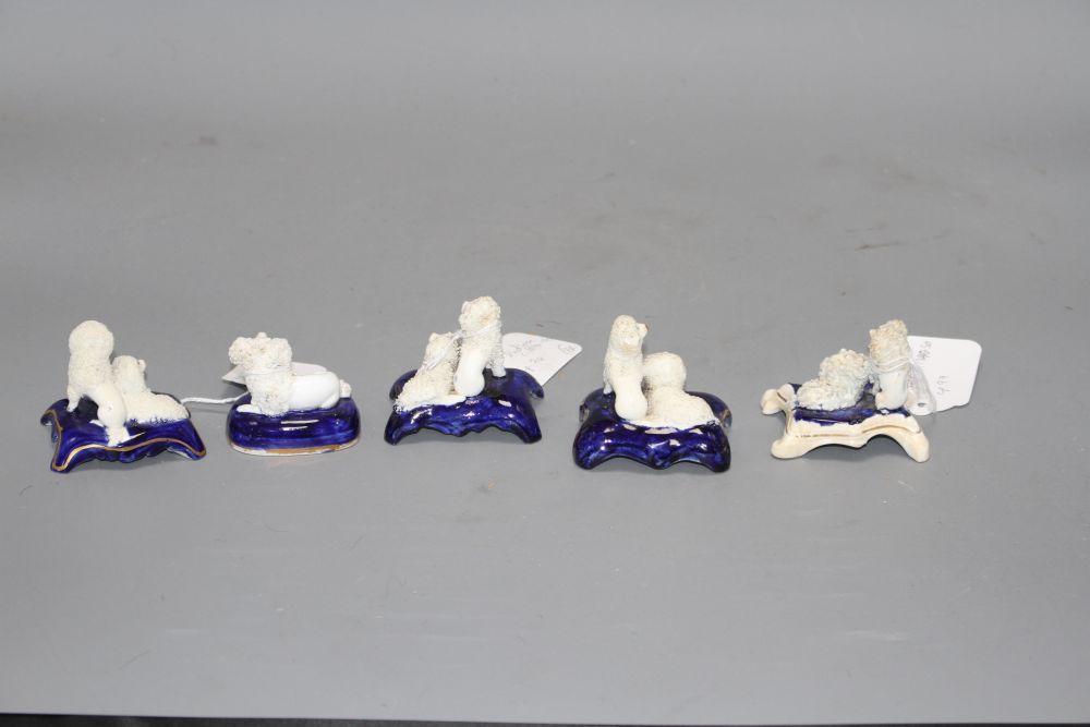 Five Staffordshire porcelain toy groups of poodles, c. 1840-50, the majority by Dudson, H. 4.2 - 5.2cm